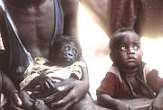 african child and chimp baby